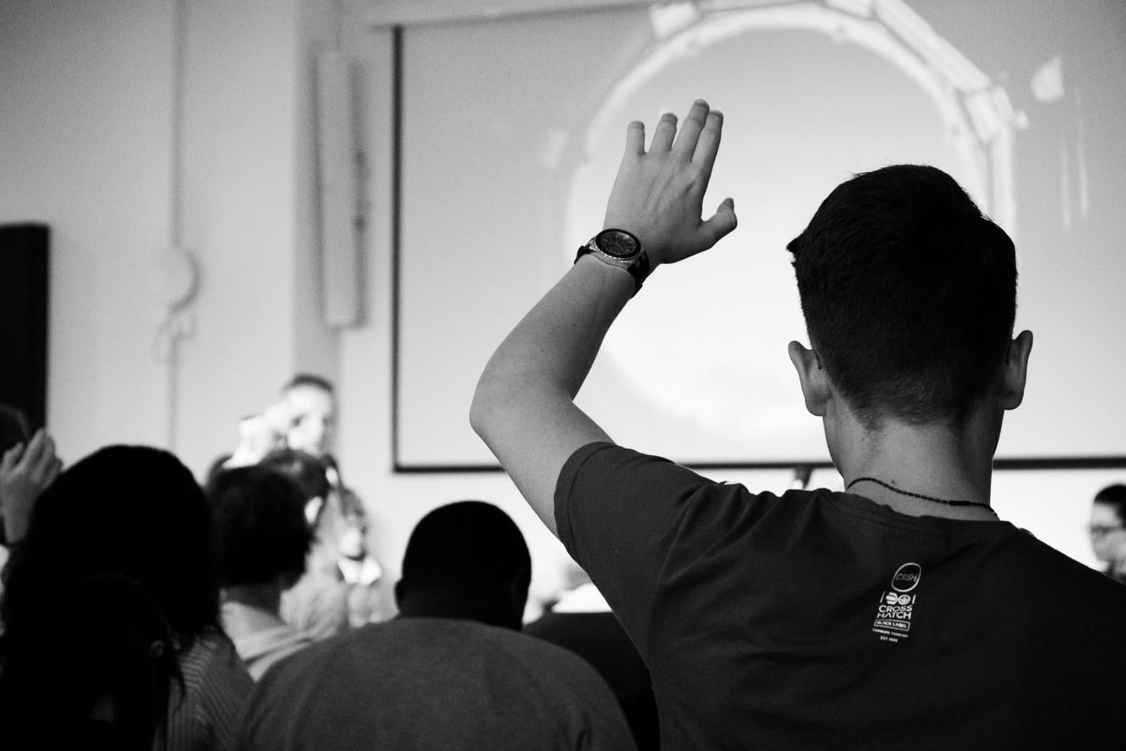 student raising hand